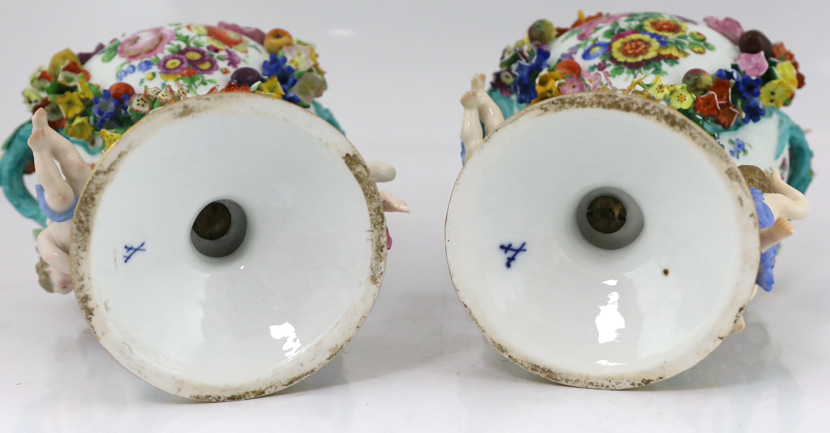 A pair of Meissen topographical flower encrusted vases and covers, 19th century, losses